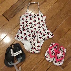 Minnie Mouse swim suit and 2 pairs of flips flops